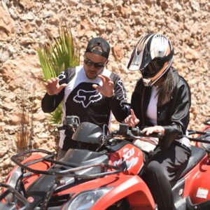 Group of friends posing with their quad bikes before starting their Agadir desert safari.