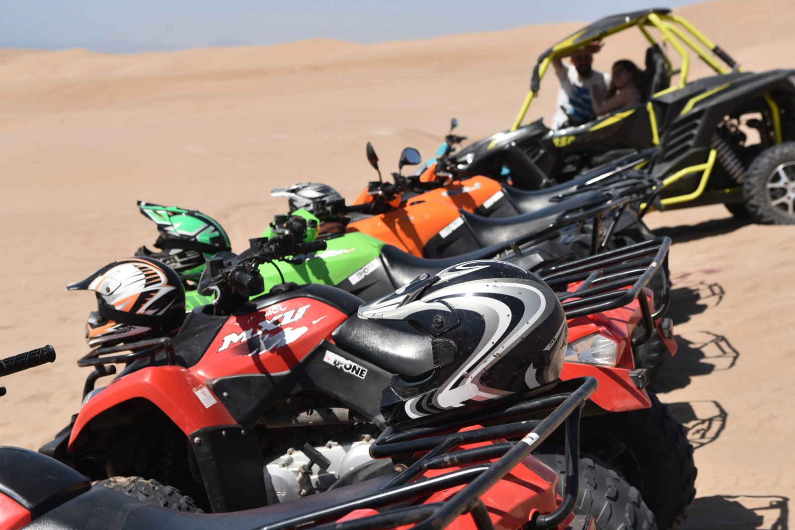 A professional guide leading a line of quad bikes during a Quad Biking Agadir excursion.